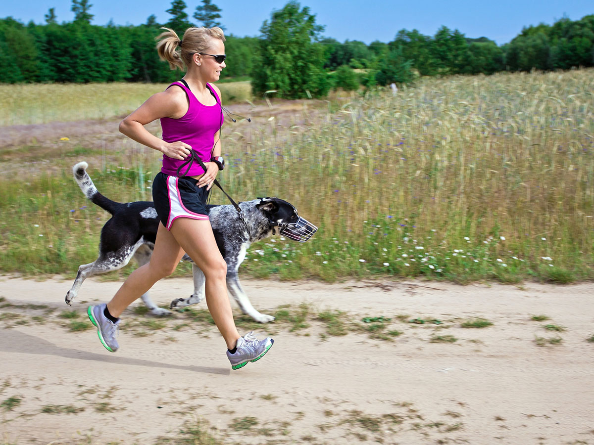woman running with her dog